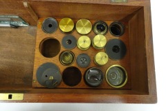 Mahogany ‘clamshell’ case with brass handle and catches.
