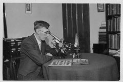 Ben Burrell with Microscopes and Accessories. c1935
