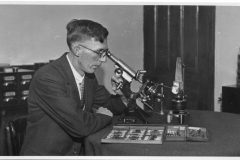 Ben Burrell with Microscopes and Accessories. c1935