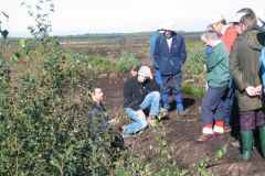 Henry Chapman and Ben Gearey talking about Micks Trackway on site, Hadfield.